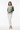 Female model - botanical cardigan with white jeans