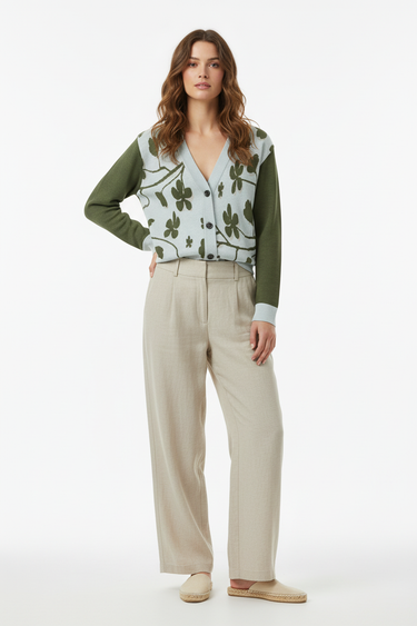 Female model - buttoned cardigan with beige linen pants
