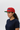 Female model red cap side profile