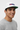 Male model close-up white cap three-quarter smile