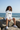 Female 3 — white biker shorts, beach rocks