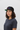Female model black red cap confident