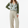 Female model - buttoned cardigan with beige linen pants