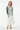 Female model - spring look with white midi skirt