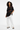 Look 9 - Layered chic with white wide-leg pants
